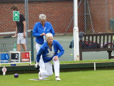 Mags Shelley sending another wood on its way with Felicity Rees behind.