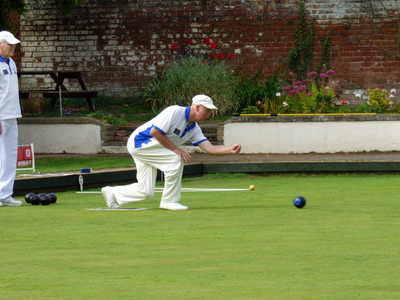 John Heather looks on as Mike Woolams sends a wood on its way. 