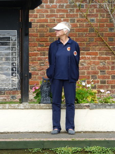 Umpire Mags Shelley in a striking blue outfit.