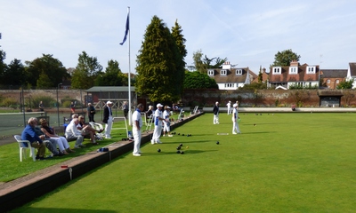 The scene showing the action at the flagpole side of the green.