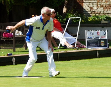 Andy Savin looks incisive as he launches another wood at the head.