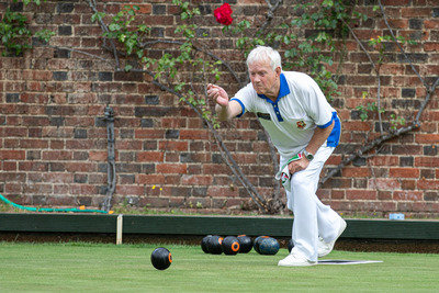 Nobby Anson stretching his arm 